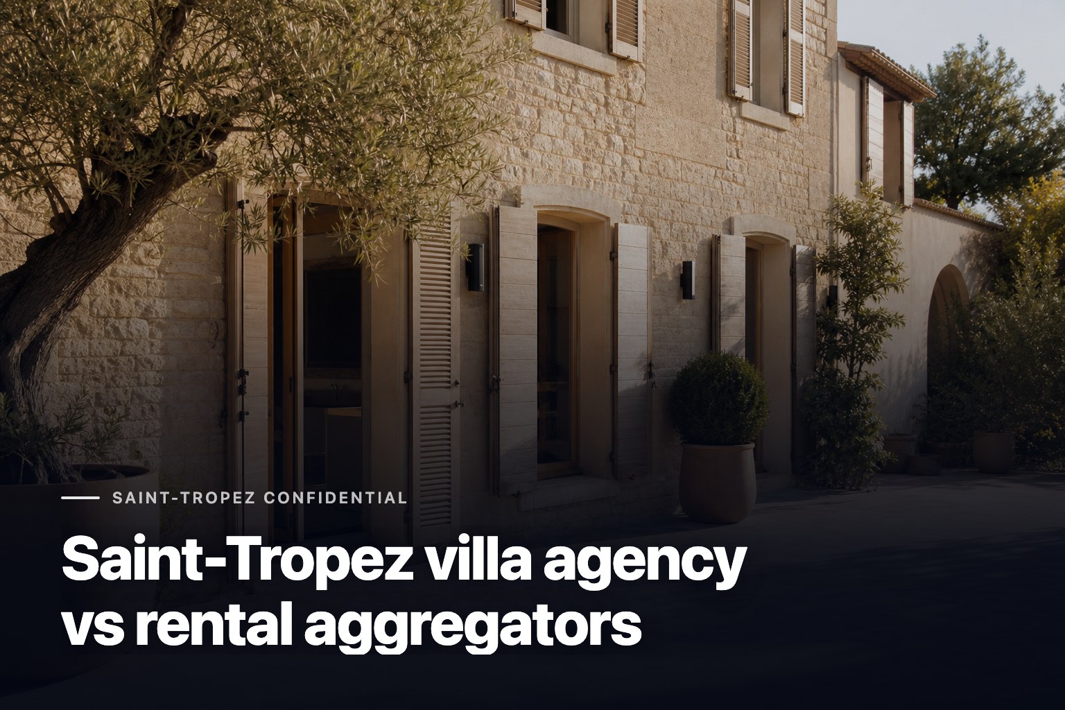 Agence de villas en Saint-Tropez storefront with stone facade and Mediterranean courtyard